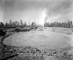 A lake of oil swallowed rigs at Conroe, north of Houston, in 1931.