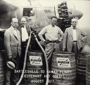 Frank and L.E. Phillips stand with the pilot of the Woolaroc monoplane in 1927.