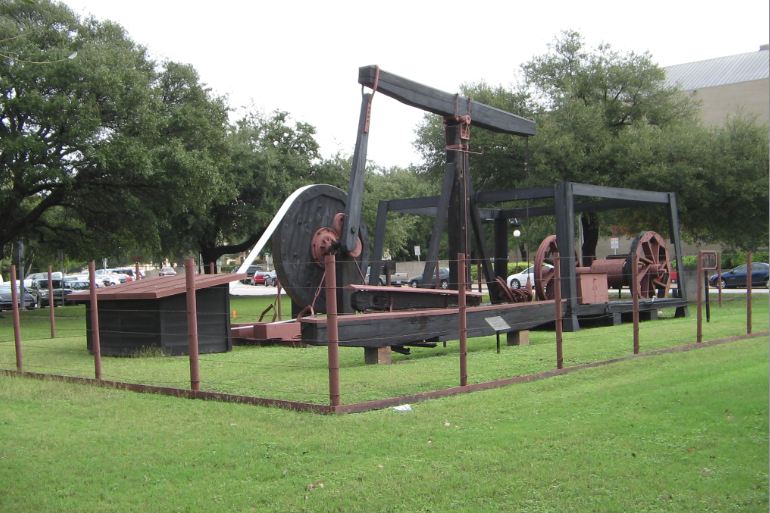 Santa Rita oil well walking beam equipment exhibit at University of Texas campus.