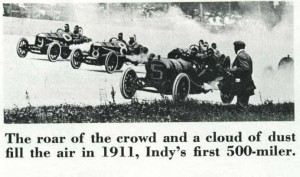Race cars in clouds of dust at first Indy 500 mile race in 1911.