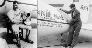 Wiley Posts stands beside his Winnie Mae airplane
