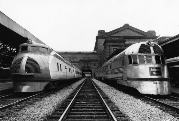 Famous railroad passenger streamliners M-1000 and Burlington Zephyr at station.