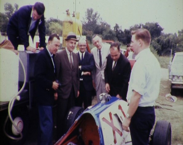 Natural gas industry executives examine LNG dragster in late 1960s