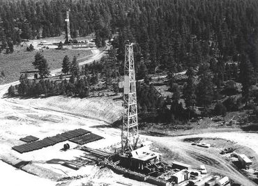 Project Gasbuggy drilling rigs at well site in Colorado.