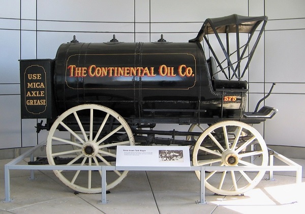 Horse-drawn oil tank wagon of Continental Oil Company.