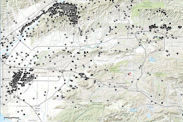  Begun more than a decade earlier as a remote "wildcat" well attempt, Conejo Hills Oil Company's 1952 Janss No. 1 exploratory well - a dry hole - is pictured in red far to the southeast of producing wells. Half-filled circles are dry holes, solid black circles are producers. Image courtesy California Division of Oil, Gas and Geothermal Resources.