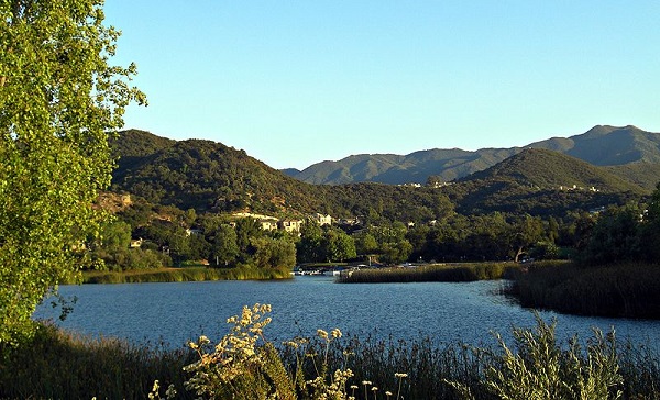 Twelve miles inland of the Pacific Ocean in the Conejo Valley, Thousand Oaks, California, has more than 125,000 residents, "nestled neatly within a picturesque plateau, rimmed by scenic hills, mountains and trees," notes a local realtor.