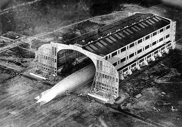 The Shenandoah, built in 1923 and shown emerging from its Lakehurst, N. J. hangar, was the United States Navy's first helium-filled airship. The Navy's second (1924) was the Los Angeles, but helium was so scarce that only one of these airships could be operated at a time.