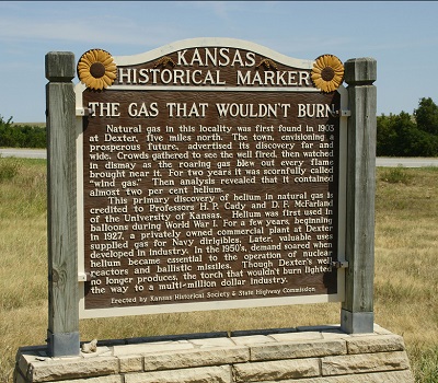 A marker near Dexter, Kansas, notes that a nearby gas well led to a scientific discovery that “lighted the way to a multi-million dollar industry.”