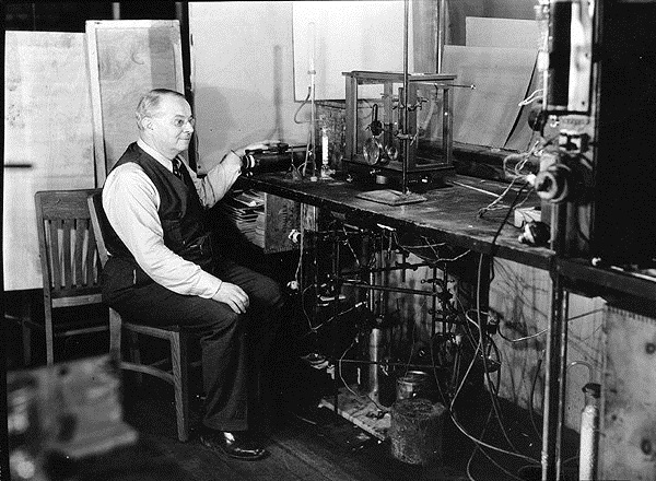 Professor Hamilton Cady with instruments at his desk at the University of Kansas, Lawrence.