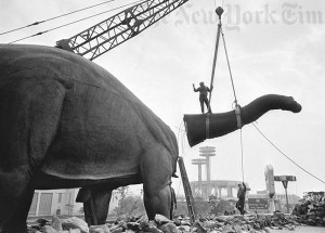 Dismantling of "the great statue that stood in the Sinclair Pavilion of the New York World's Fair, 1965." 