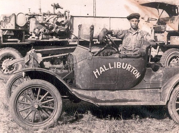 George Halliburton, younger brother of Erle P. Halliburton, sits at the wheel of company service truck
