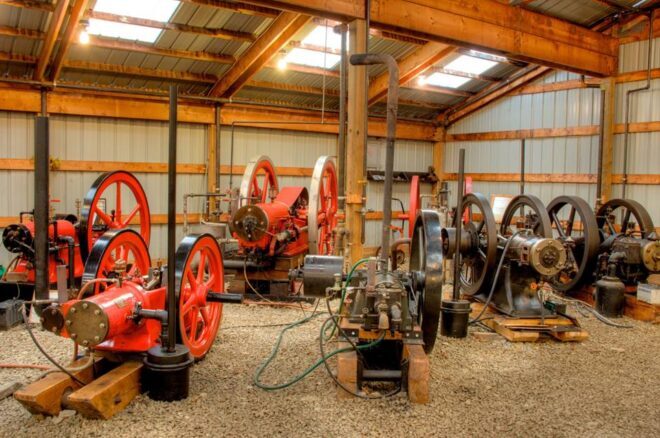 Interior of Coolspring Power Museum with many one-cylinder egines.