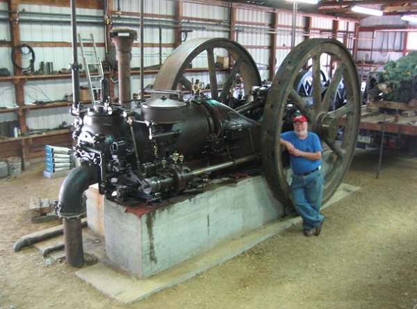 Paul Harvey, co-founder of the Coolspring Power Museum in Pennsylvania, stands next to the 175 HP Otto engine.