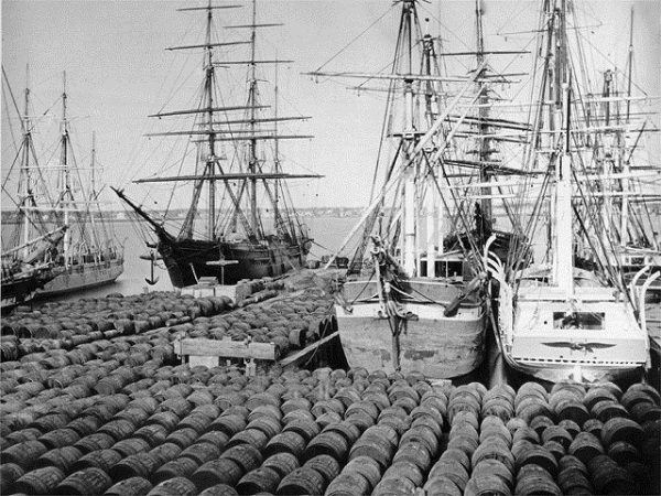 America exports oil vintage photo of loading dock barrels circa 1870.