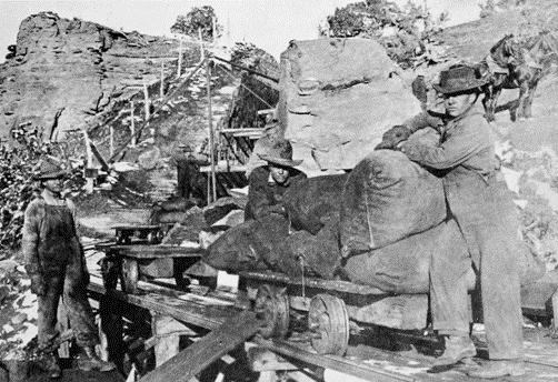 Miners remove Gilsonite from narrow mines, circa 1920s.