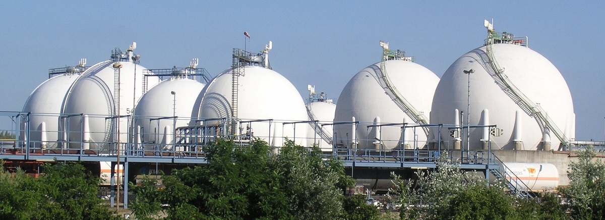 A row of giant, white Hortonspheres for storing LNG.