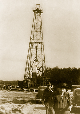 Circa 1950 Alabama oil well steel drilling derrick.