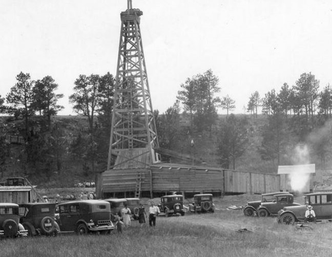 january petroleum history wooden oil derrick and cars circa 1929