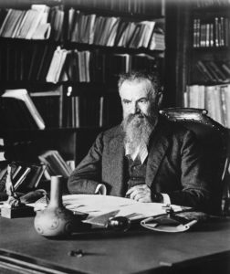 John Wesley Powell, director of the United States Geological Survey, sits at his desk