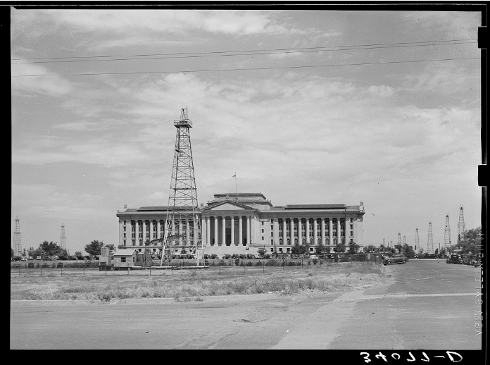 "Capitol of Oklahoma with surrounding derricks. Oklahoma City, Oklahoma," August 1939, by Russell Lee (1903-1986) for Farm Security Administration. Photo courtesy Library of Congress.
