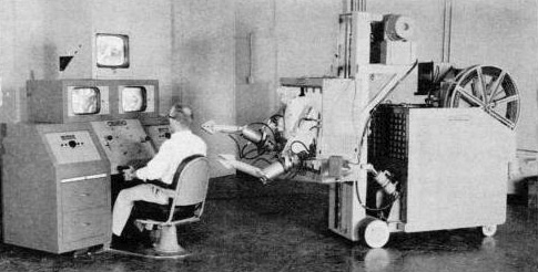Popular Science article shows scientist testing early remotely operated robot.