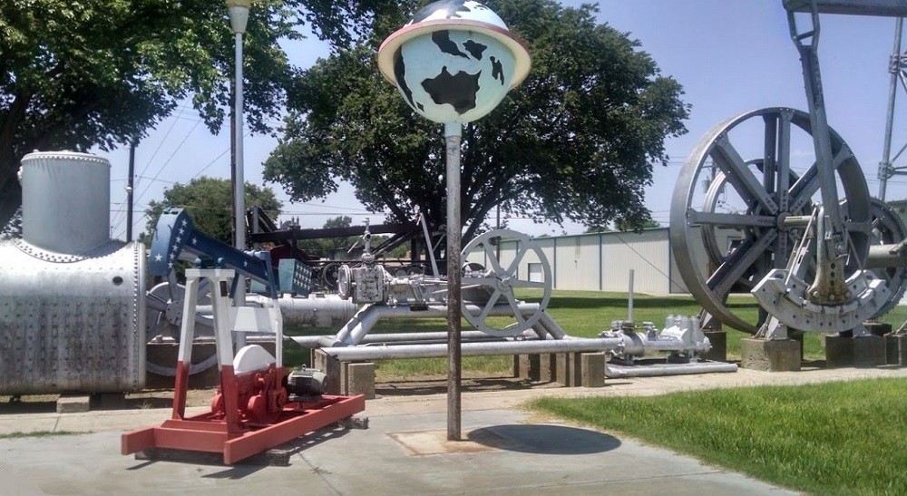 Outdoor oilfield equipment exhibits at natural gas museum in Hugoton, Kansas.