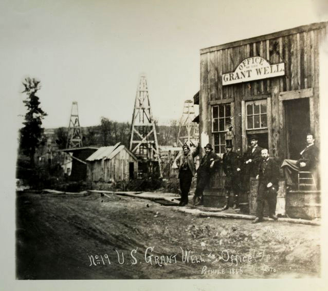 
1865 photograph of U.S. Grant oil well and office at Pithole, Pennsylvania. 